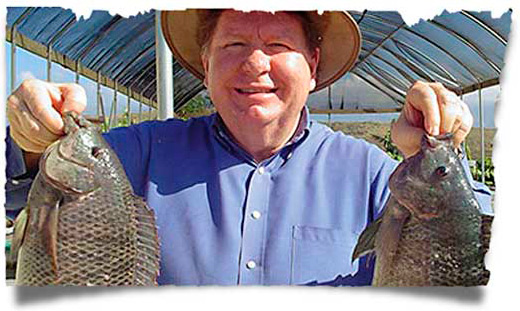 Bobby Burnette with our sustainability project - Love A Child's Tilapia Fish Farm in Haiti