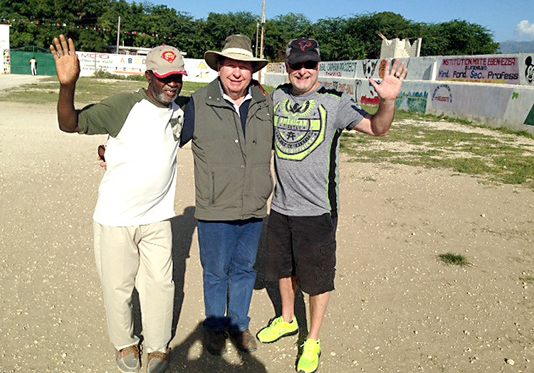 Pastor Claude, Bobby and David George standing on the land for the new church.